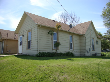 Before the house move and rehabilitation... a historic home is buried under that aluminum siding.