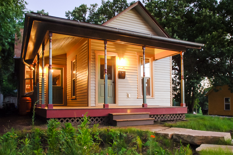 After being move to a new lot, a full exterior restoration was completed, including a new front porch with a footprint similar to the original.