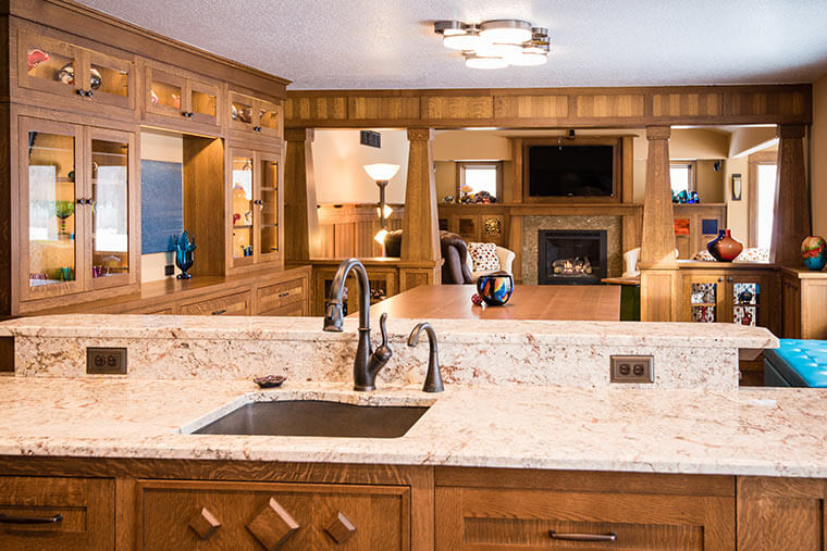 Craftsman-style kitchen and dining room remodel in West Des Moines by Silent Rivers includes a custom designed table