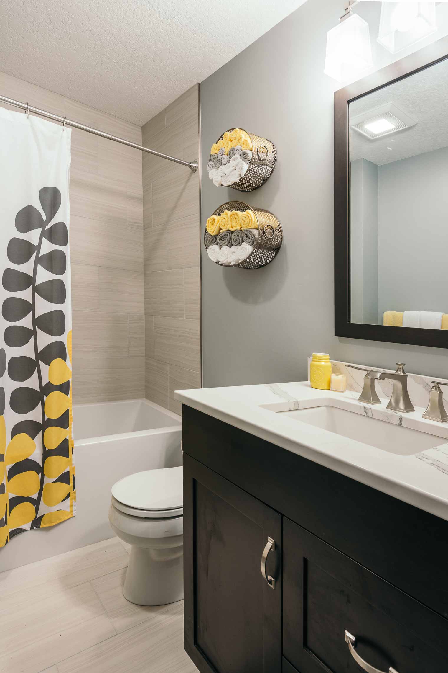 Clean contemporary gray and yellow bathroom by Silent Rivers, Des Moines remodeler