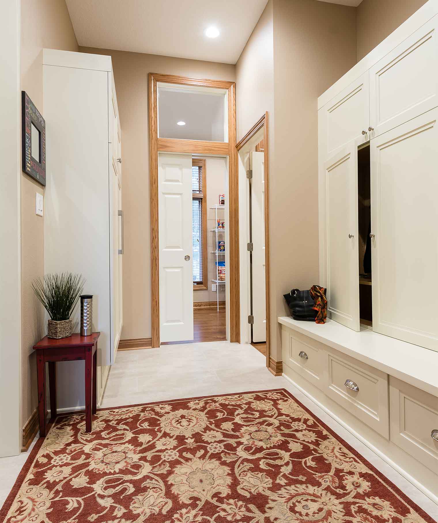 mudroom dropzone flows into kitchen and pantry area in large kitchen remodel designed and built by Silent Rivers in Clive, Iowa
