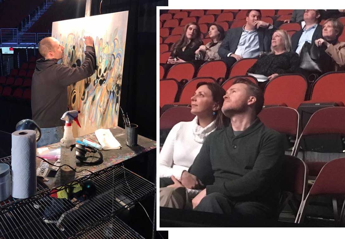 Des Moines artist Chris Vance completes a live painting at the Des Moines Arts Festival REVEAL event, guests watch from the stands the reveal of DMAF 2017 artists on the jumbotron