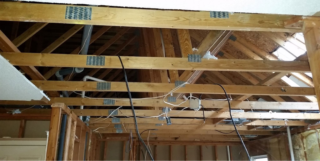 Photo taken during remodeling of master suite by Silent Rivers of Des Moines shows roof trusses being modified with help of structural engineer