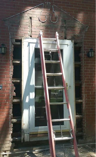 in progress photo of new front entryway and door being installed on 1935 Des Moines Federal style house front entry remodel by Silent Rivers
