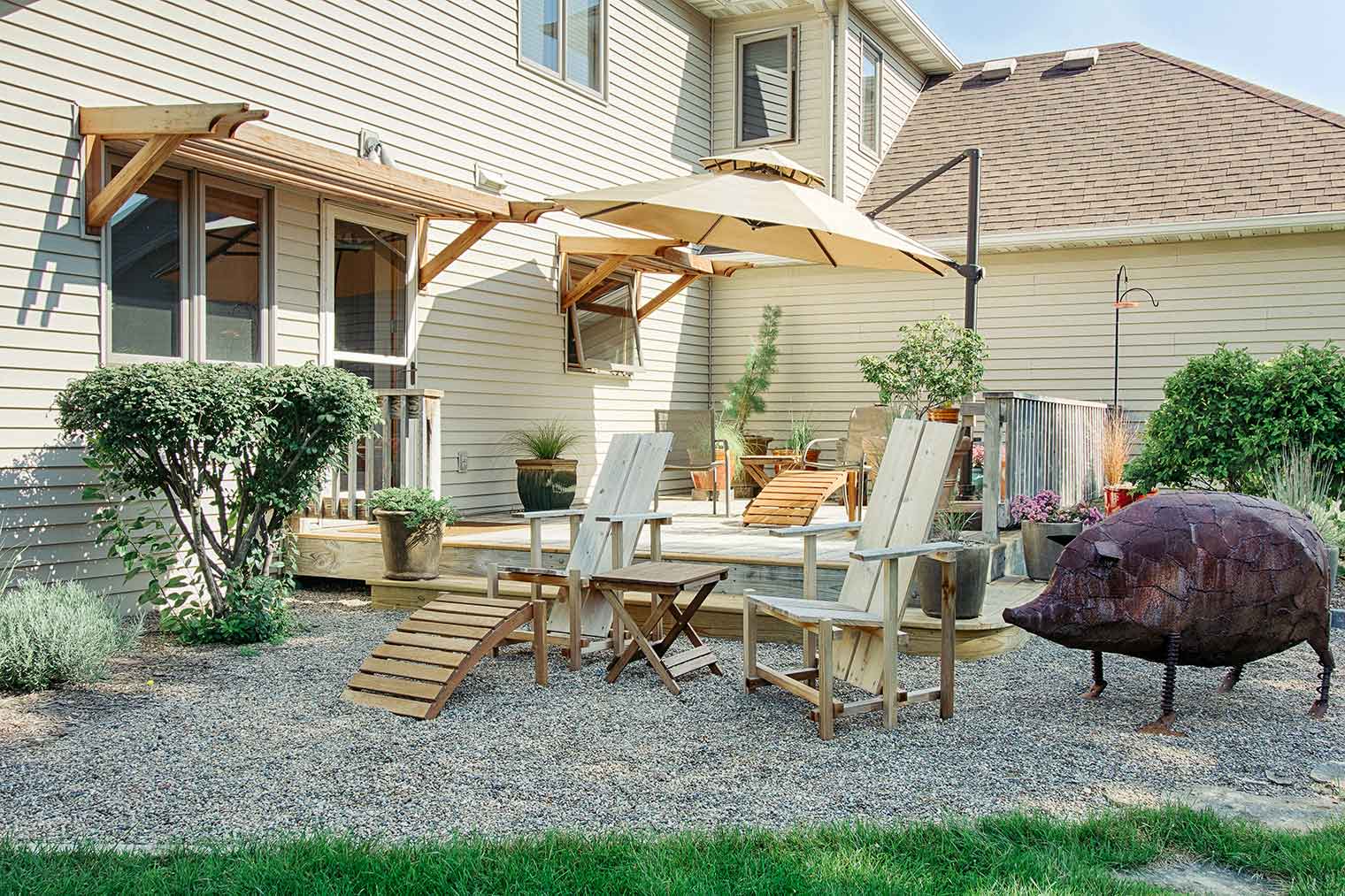 Asian style custom Adirondack chairs for Asian deck and patio with wood awnings at Ames home exterior remodel by Silent Rivers