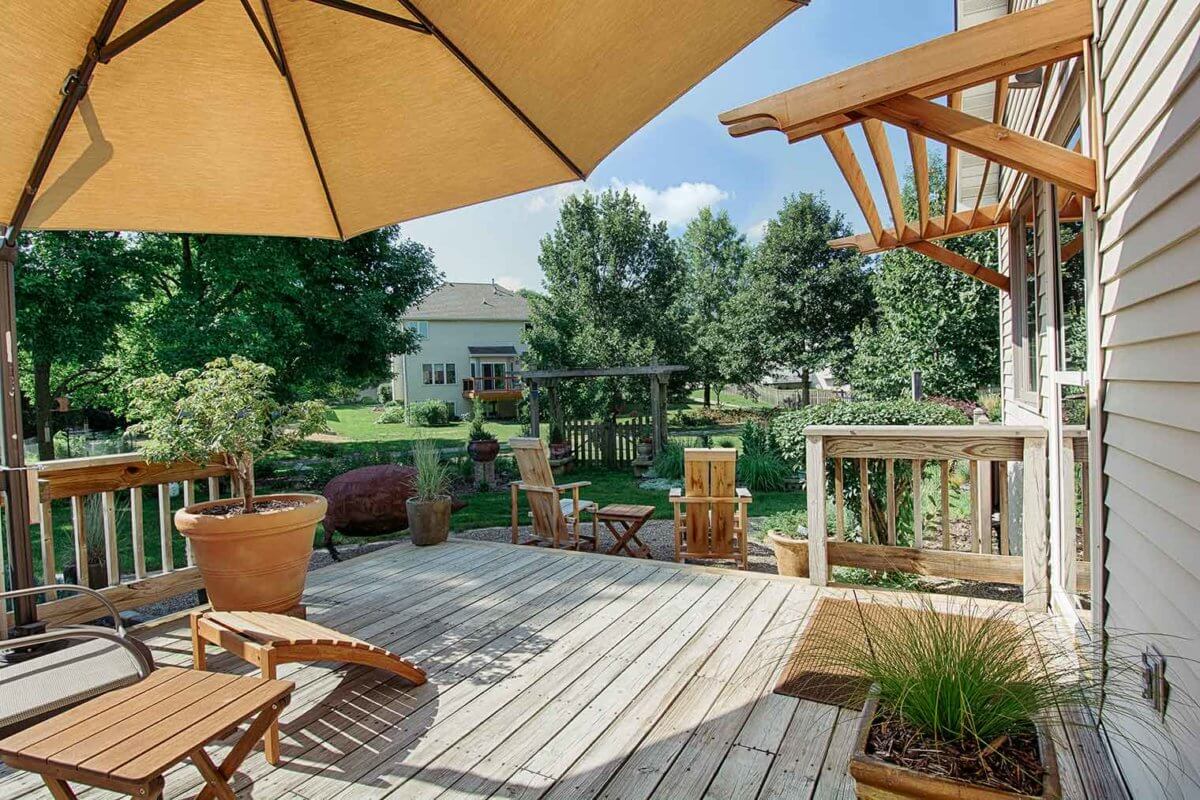 Asian style deck and patio with wood awnings and Asian Adirondack custom chairs by Silent Rivers Des Moines