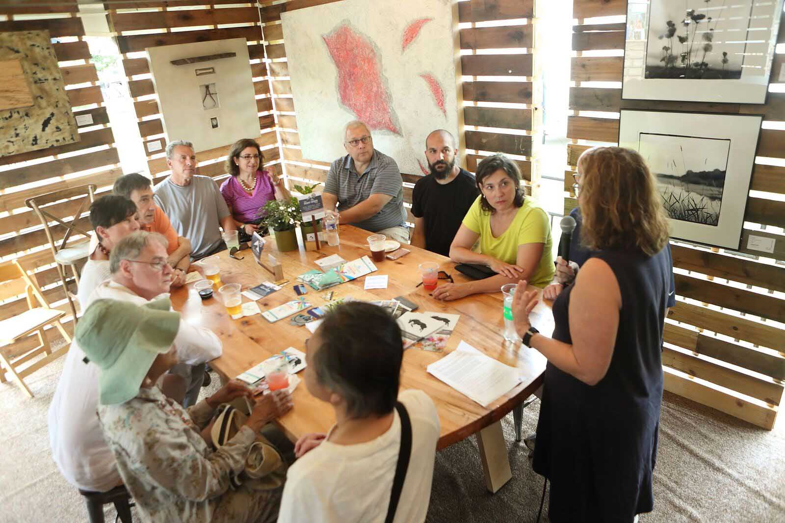Dr. Lenore Metrick-Chen, art history professor, DMAF Curated exhibit and presentations in the Creative Cafe area of the Silent Rivers VIP Club at the 2018 Des Moines Arts Festival