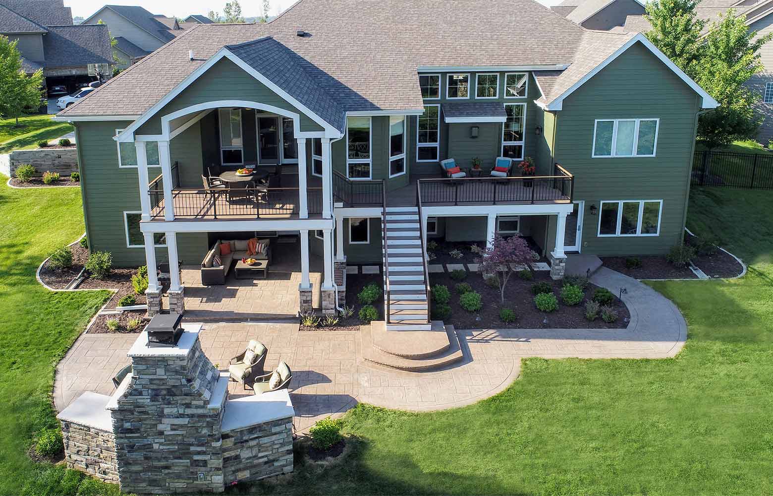 Urbandale, Iowa home with new deck, patio and outdoor fireplace by Silent Rivers