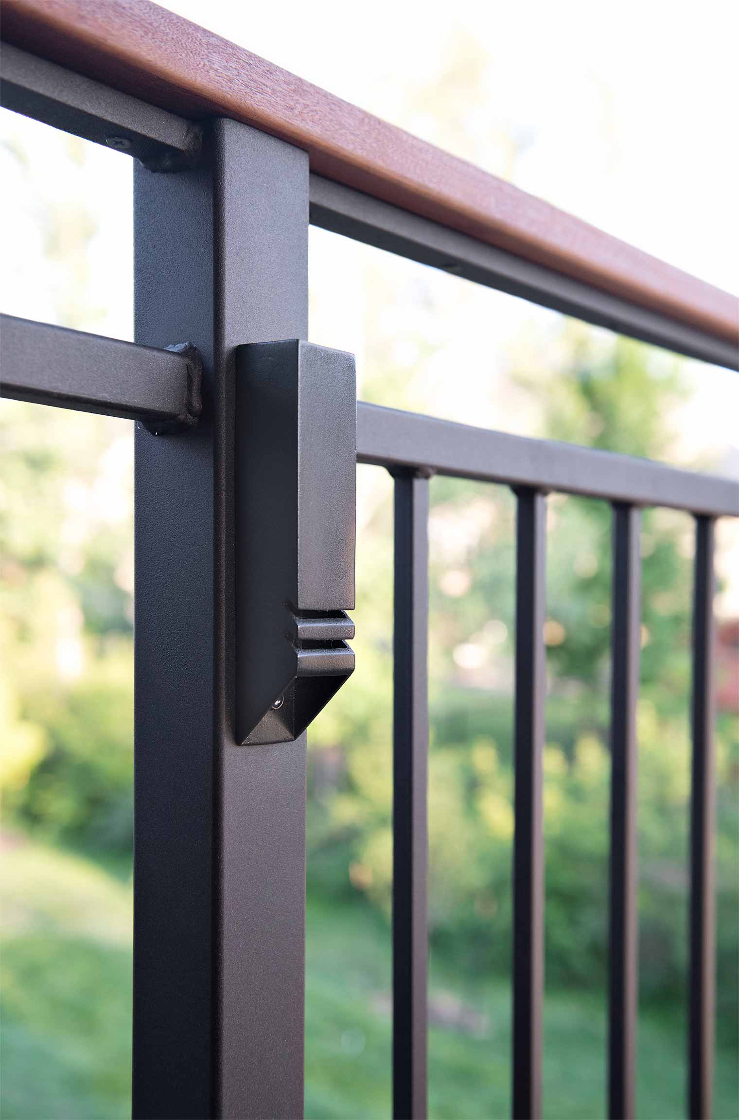 Urbandale Iowa deck railing with integrated lighting and teak drink rail by Silent Rivers