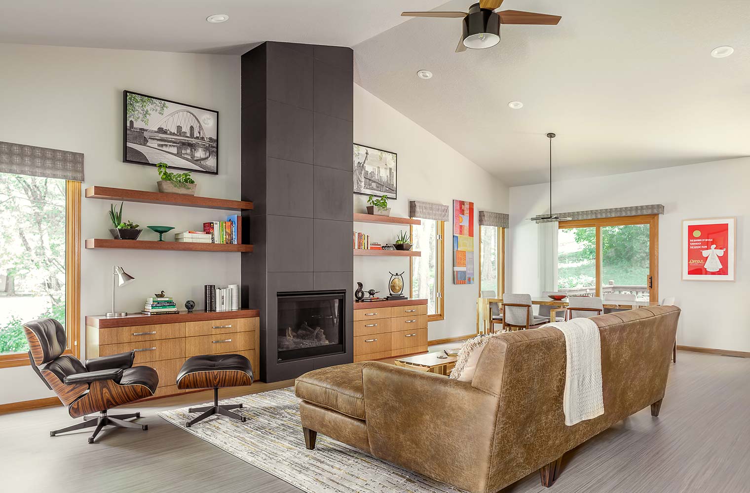 living room remodel with tall dark fireplace